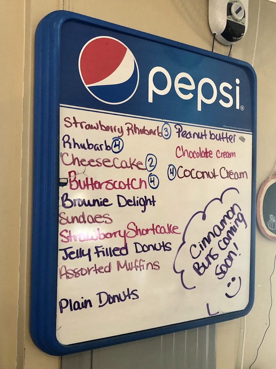 Menu board showing breakfast plates and daily specials.